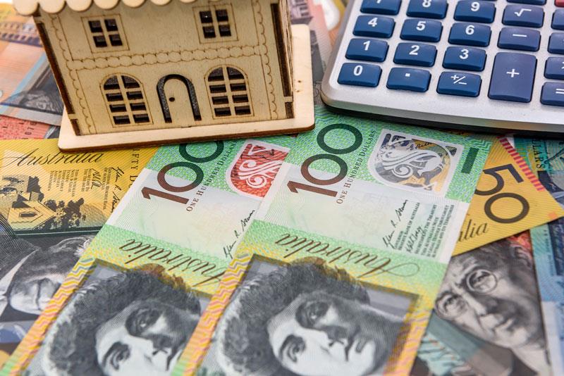 image of a house, Australian currency and a calculator